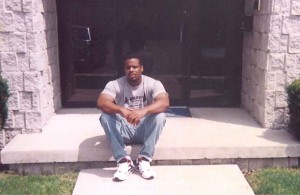 Jerry Calliste Jr. in front of new Massimo Investment  Association, LTD office. Columbus, Ohio 1995